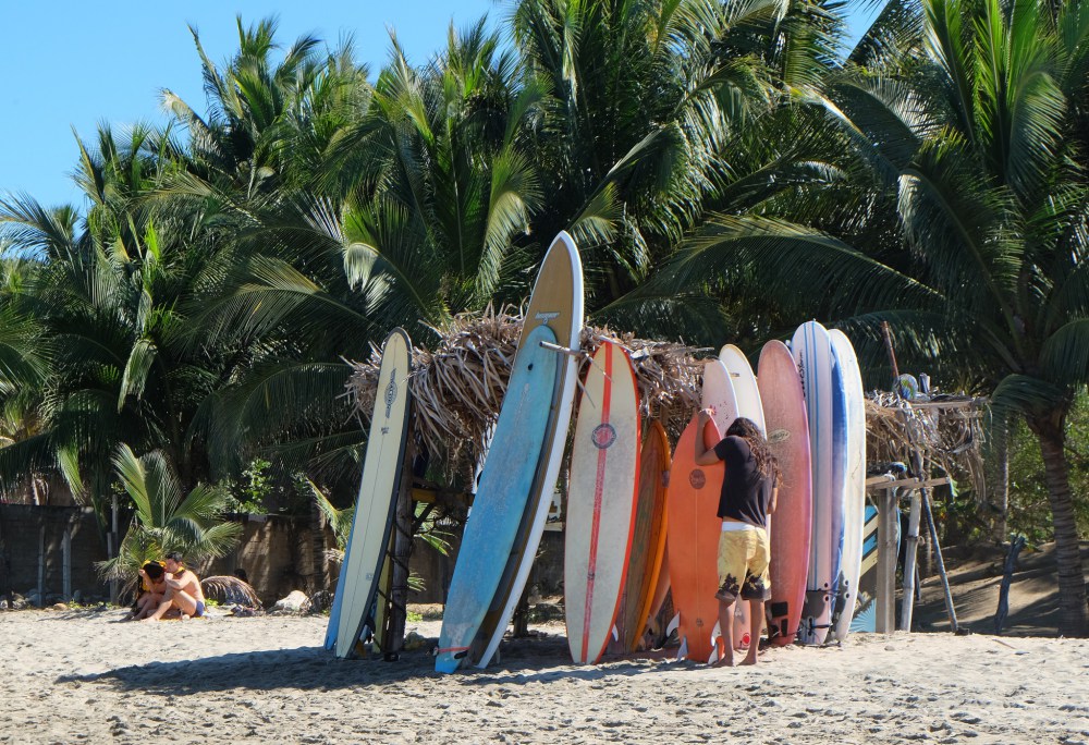 Tending his surfboards