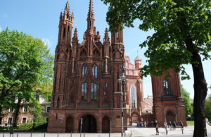 The two brick churches and their shared bell tower. Locals call the trio "two swans and an ugly duckling'