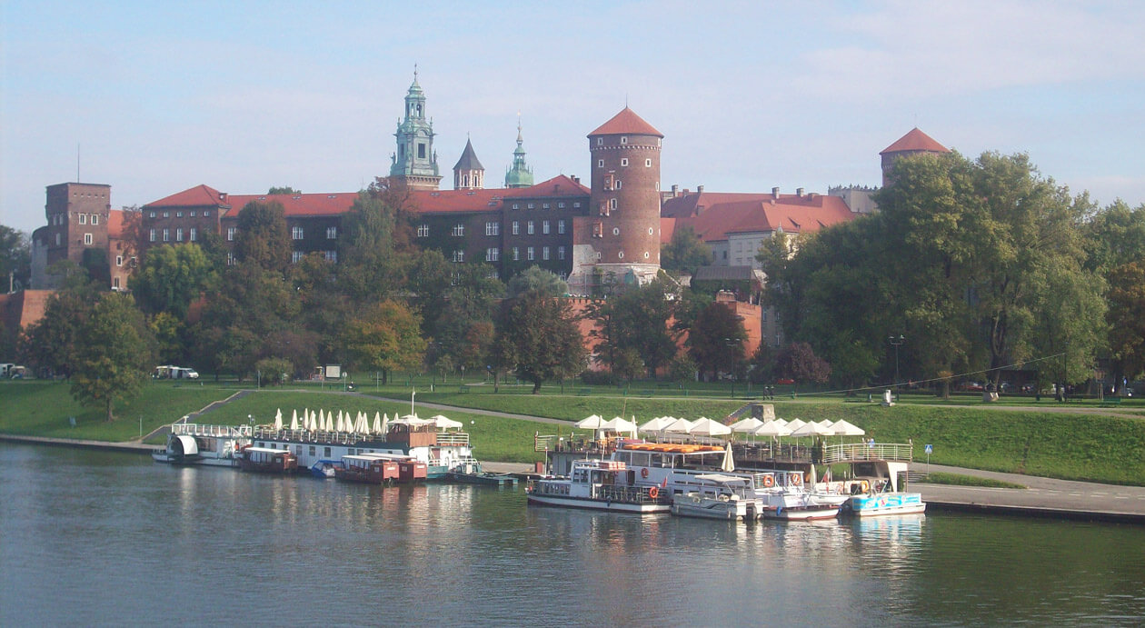 Strolling around the Vistula river in Krakow, Poland, with magnificent views of Wawel Castle