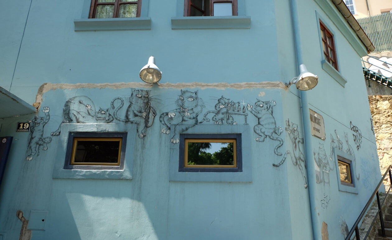 Street art of cats on a cafe's wall on Tkalčićeva Street