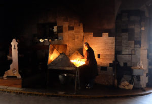 Lighting candles at the Stone Gate