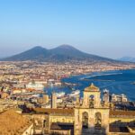 A view of Naples from above, with Mount Vesuvius in the background.