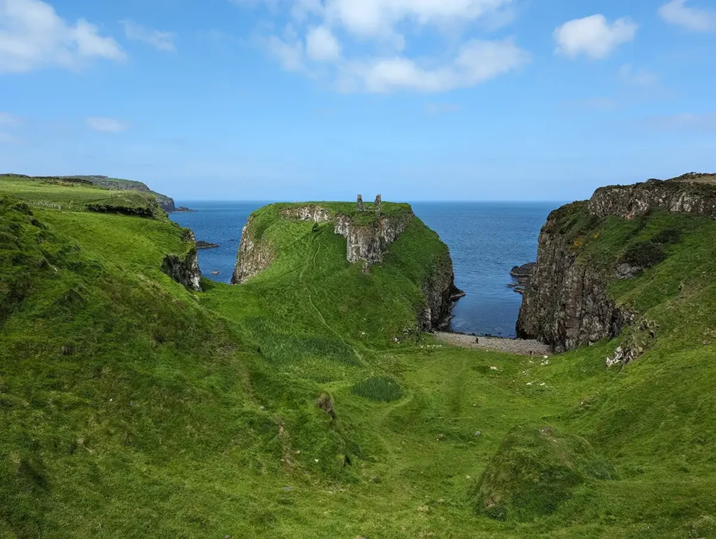 A ruined castle on a high cliff above the sea