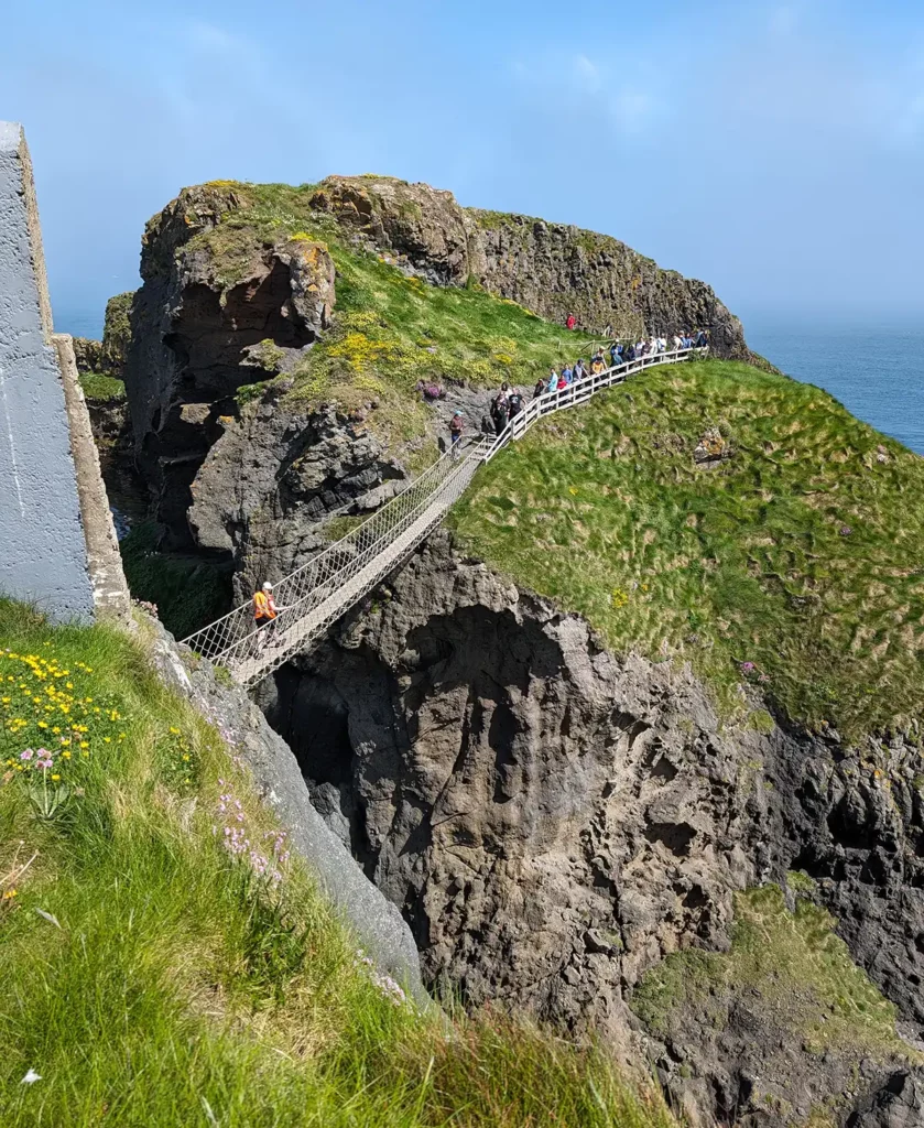 A rope bridge across a pair of steep cliffs