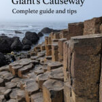 A photo of the Giant's Causeway, with the text "Visiting the Giant's Causeway, complete guide and tips"