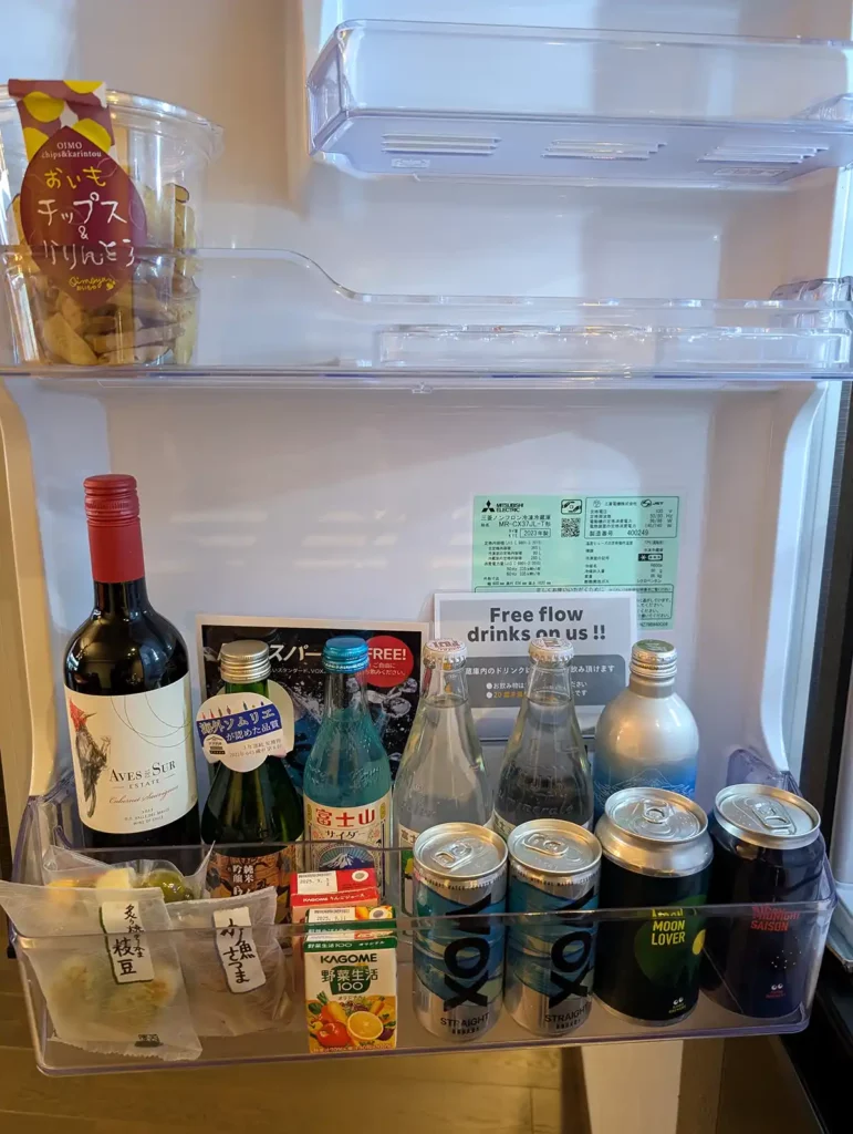 A fridge stocked with wine, beer and soft drinks