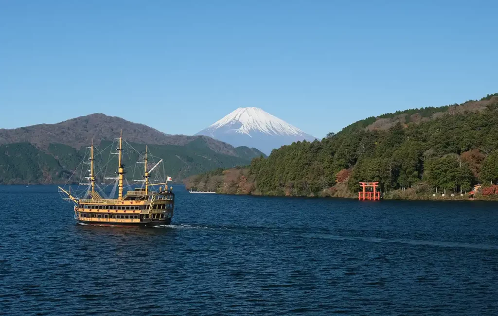 Mount Fuji and Lake Ashi, with a pirate ship sailing across the lake.