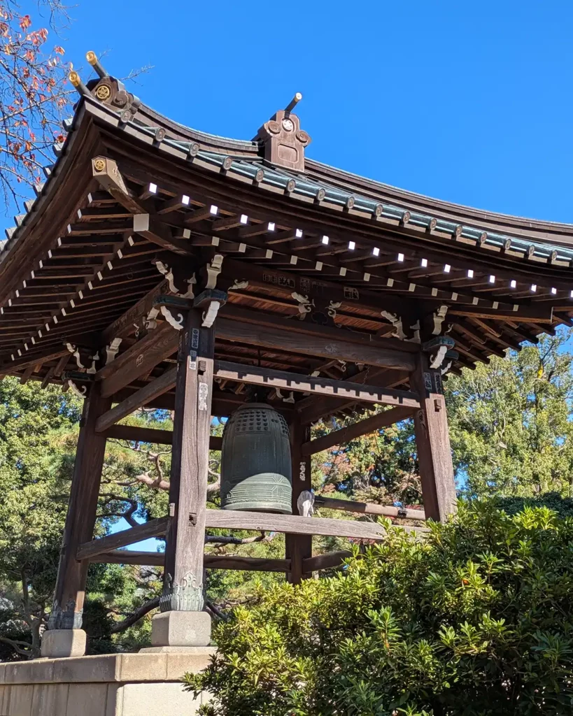 A huge bell, sheltered by a traditional style roof