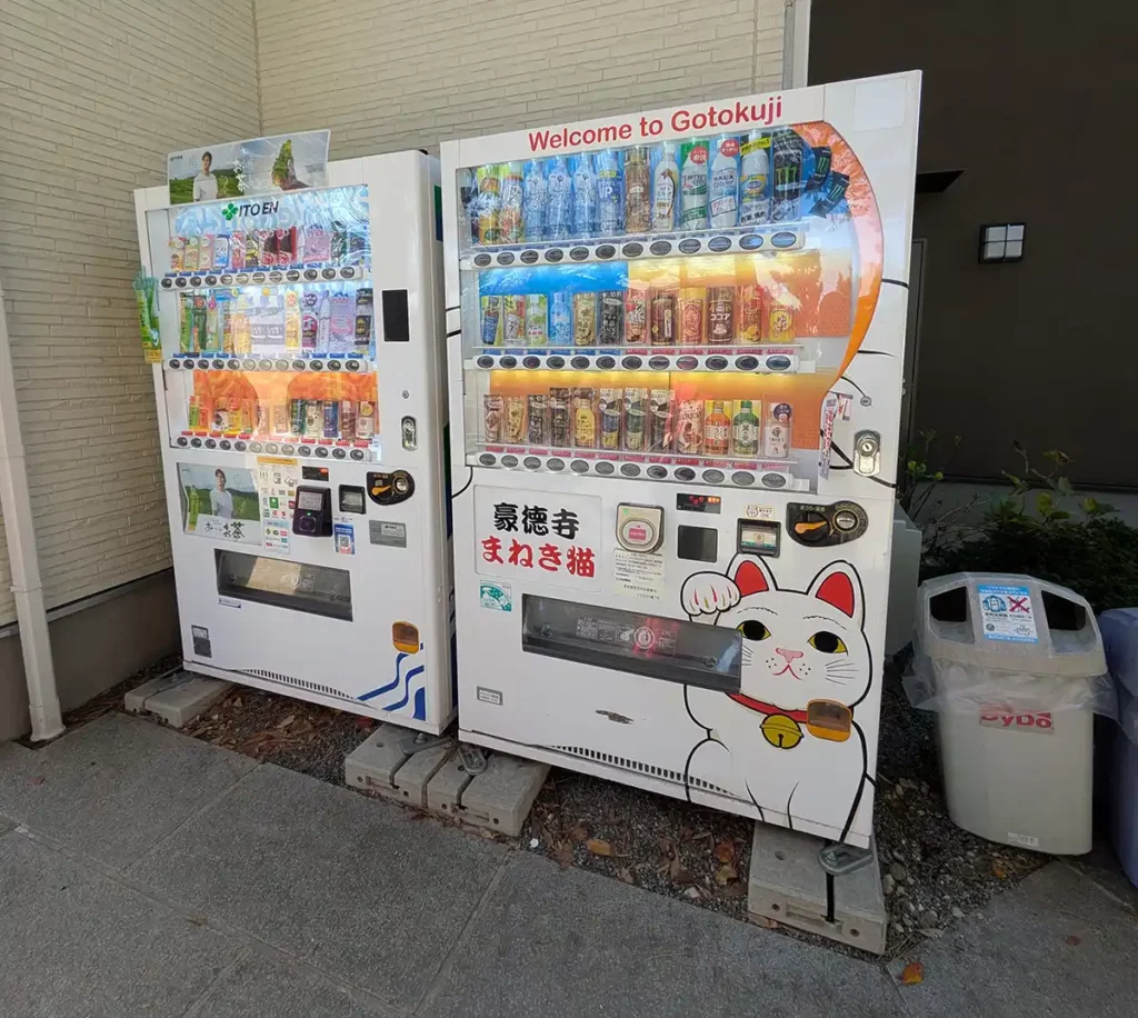 Vending machines with a lucky cat picture