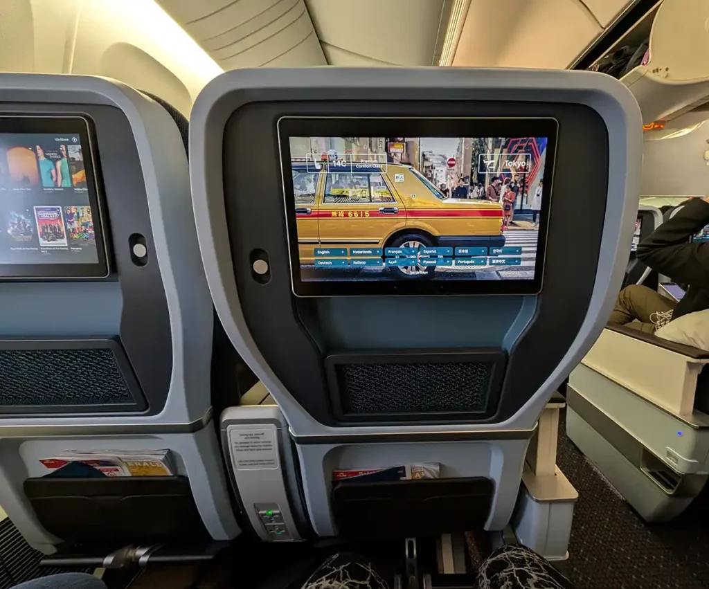 The back of a KLM premium economy seat, with a large entertainment screen