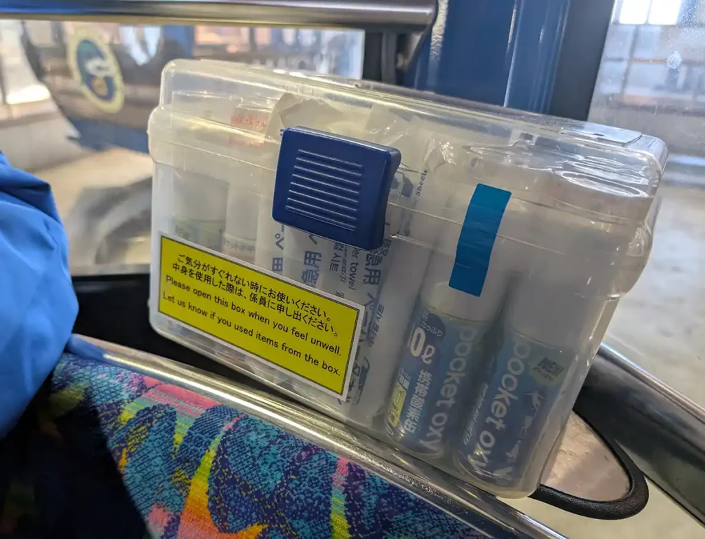 A clear plastic tub full of oxygen canisters