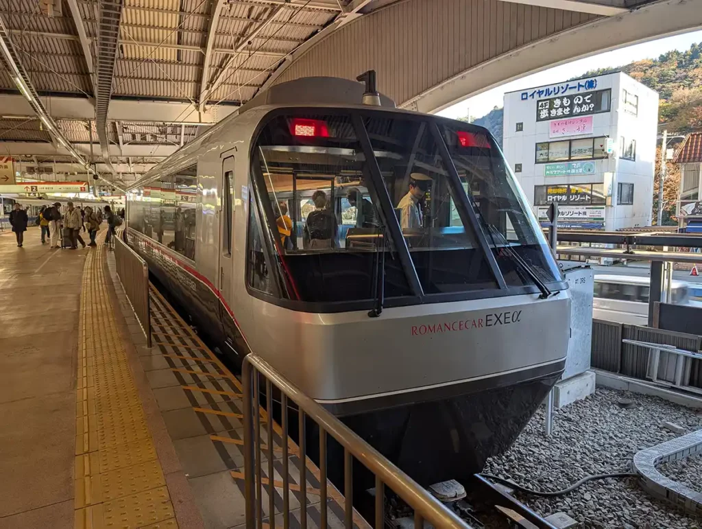 A blue and silver train at a platform