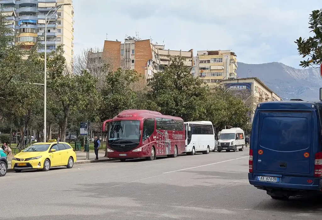 A coach waiting to take passengers to Tirana Airport