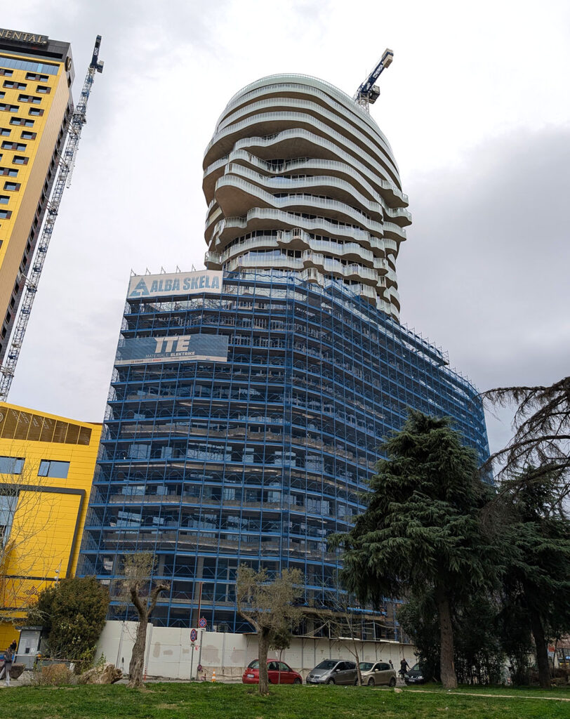 A new skyscraper being built, in the shape of a man's head