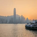 A Hong Kong Star Ferry crossing Victoria Harbour at sunset